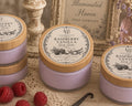 Raspberry Vanilla Emulsified Body Butter jar with bamboo lid and Illuminated Haven Victorian label with raspberries and vanilla bean